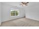 Room with carpet floors, bright light, white walls and a view at 4915 Bergen Ct, Cumming, GA 30040