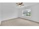 Room with carpet floors, white walls, bright light and a ceiling fan at 4915 Bergen Ct, Cumming, GA 30040