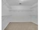 Spacious walk-in closet with carpeted floor and wire shelving for optimal storage solutions at 4915 Bergen Ct, Cumming, GA 30040