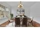 An elegant dining room features hardwood floors, a chandelier, and classic decor at 4915 Bergen Ct, Cumming, GA 30040