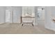 Hallway with neutral carpet and natural light that leads into two bedrooms at 4915 Bergen Ct, Cumming, GA 30040