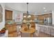 Well-equipped kitchen featuring wood cabinets, stainless steel appliances, and a center island with seating at 4915 Bergen Ct, Cumming, GA 30040
