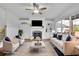 Bright and airy living room with a fireplace, built-ins, and ample seating at 4915 Bergen Ct, Cumming, GA 30040