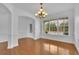 A bright living room with hardwood floors, white trim, and a window view at 4915 Bergen Ct, Cumming, GA 30040