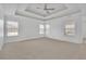 Bright main bedroom features carpet, neutral tones, a trey ceiling, and ample natural light at 4915 Bergen Ct, Cumming, GA 30040