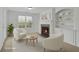 Cozy sitting room featuring a fireplace, built-in bookshelves, and neutral decor at 4915 Bergen Ct, Cumming, GA 30040