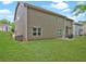 Expansive backyard featuring lush green lawn with back house view and outdoor patio space at 5280 Clingman Ct, Douglasville, GA 30135