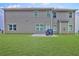 Large backyard featuring a well-maintained lawn and patio, perfect for outdoor activities and relaxation at 5280 Clingman Ct, Douglasville, GA 30135