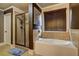Bright bathroom with a soaking tub and separate glass shower at 5280 Clingman Ct, Douglasville, GA 30135