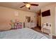 Bedroom with a ceiling fan and pink accents at 5280 Clingman Ct, Douglasville, GA 30135