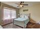 Bright bedroom with large window and light pink curtains at 5280 Clingman Ct, Douglasville, GA 30135
