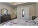 Bedroom featuring neutral walls, a bed, dresser, and double door closet at 5280 Clingman Ct, Douglasville, GA 30135