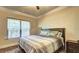 Cozy bedroom with a ceiling fan, and large window providing natural light at 5280 Clingman Ct, Douglasville, GA 30135