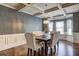 Elegant dining room with coffered ceilings, wainscoting, and stylish chandelier at 5280 Clingman Ct, Douglasville, GA 30135