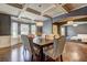Elegant dining room with coffered ceiling and stylish chandelier lighting fixture at 5280 Clingman Ct, Douglasville, GA 30135