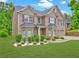 Charming two-story home featuring a brick facade, well-manicured lawn, and tasteful landscaping at 5280 Clingman Ct, Douglasville, GA 30135