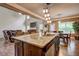 Open kitchen with granite island, seating, stainless appliances, and view to the living room at 5280 Clingman Ct, Douglasville, GA 30135