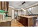 Large kitchen island with granite countertop, pendant lighting, and open layout design at 5280 Clingman Ct, Douglasville, GA 30135