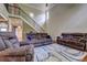 Cozy living room with hardwood floors, comfortable seating, and staircase access at 5280 Clingman Ct, Douglasville, GA 30135
