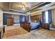 Large main bedroom with tray ceiling, a ceiling fan, and en suite bathroom at 5280 Clingman Ct, Douglasville, GA 30135