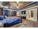 Stylish main bedroom with tray ceiling, dark accent wall and open layout at 5280 Clingman Ct, Douglasville, GA 30135