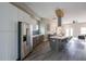 Open kitchen area with stainless steel appliances, white cabinets, and a view of the open-concept living space at 125 Laurel Sw Ave, Atlanta, GA 30314