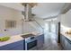 Updated kitchen with stainless steel appliances, large island with seating, and hardwood flooring at 125 Laurel Sw Ave, Atlanta, GA 30314