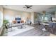 Open-concept living area with modern furniture, a stylish rug, and seamless access to the dining and kitchen areas at 125 Laurel Sw Ave, Atlanta, GA 30314