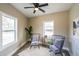 Cozy living room featuring neutral walls, two chairs, and abundant natural light from large windows at 125 Laurel Sw Ave, Atlanta, GA 30314