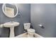 Stylish half-bathroom with pedestal sink and gray walls offers a clean, modern look at 432 Tanner Farm Dr, Rockmart, GA 30153