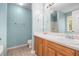 Bathroom with double sinks, wood cabinets, a walk-in shower, and blue walls at 432 Tanner Farm Dr, Rockmart, GA 30153