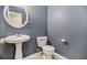 Half bathroom with pedestal sink, toilet, and neutral tile flooring at 432 Tanner Farm Dr, Rockmart, GA 30153