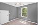 Bedroom featuring light gray walls, carpet, and natural light from a window at 432 Tanner Farm Dr, Rockmart, GA 30153