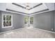 Bright bedroom with large windows offering natural light and views of the surrounding trees and landscape at 432 Tanner Farm Dr, Rockmart, GA 30153