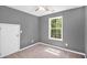 Bedroom with light gray paint and large window at 432 Tanner Farm Dr, Rockmart, GA 30153