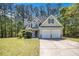 Charming two-story home with a manicured lawn and attached two-car garage at 432 Tanner Farm Dr, Rockmart, GA 30153