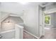 Upstairs hallway offering views of bedrooms and windows, designed to facilitate movement around the house at 432 Tanner Farm Dr, Rockmart, GA 30153