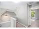 Hallway with neutral walls leading to a bedroom with large windows and a ceiling fan at 432 Tanner Farm Dr, Rockmart, GA 30153