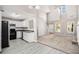 Sunlit, open concept living room features kitchen access, stone fireplace and a soaring vaulted ceiling at 432 Tanner Farm Dr, Rockmart, GA 30153