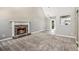 Living room with a fireplace, carpet and view of the kitchen at 432 Tanner Farm Dr, Rockmart, GA 30153