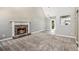 Open-concept living space features a stone fireplace, vaulted ceilings, and seamless access to the kitchen at 432 Tanner Farm Dr, Rockmart, GA 30153