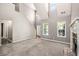 Bright living room with high ceilings, many windows, and gray carpet at 432 Tanner Farm Dr, Rockmart, GA 30153