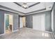 Spacious main bedroom featuring trey ceiling, plush carpeting, and an en suite bathroom for added privacy and convenience at 432 Tanner Farm Dr, Rockmart, GA 30153
