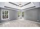 Bright main bedroom with large windows and neutral carpeting at 432 Tanner Farm Dr, Rockmart, GA 30153