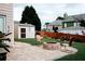 Picturesque backyard featuring a cozy patio, fire pit, and a storage shed for outdoor essentials at 4406 Dickens Nw Ct, Kennesaw, GA 30144