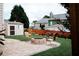 Spacious backyard with a brick patio, a cozy fire pit, and well-maintained landscaping at 4406 Dickens Nw Ct, Kennesaw, GA 30144