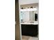Modern bathroom with double vanity, granite countertop, dark wood cabinetry at 4406 Dickens Nw Ct, Kennesaw, GA 30144