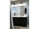 Elegant bathroom featuring a double vanity with marble countertop, offering ample space and style at 4406 Dickens Nw Ct, Kennesaw, GA 30144