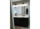 Spacious bathroom featuring a double vanity with marble countertop and decorative lighting for an inviting ambiance at 4406 Dickens Nw Ct, Kennesaw, GA 30144