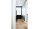 Cozy bedroom with a dark nightstand, featuring modern decor and natural light from the window at 4406 Dickens Nw Ct, Kennesaw, GA 30144